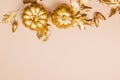 Template with Fall decor in golden colors and empty space. Gold painted leaves, pumpkins and acorns, autumn season Royalty Free Stock Photo