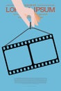 Template for festival retro cinema. Hand holding film strip on blue background. Cinema background. Movie template concept Royalty Free Stock Photo