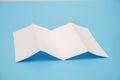 Template fold white paper on blue background Royalty Free Stock Photo