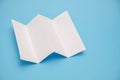 Template fold white paper on blue background Royalty Free Stock Photo