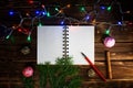 Template letters with New Year and Christmas greetings or a list of gifts. Opened notebook is located horizontally