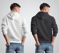 Template mockup white and black hoodies on a young guy, rear view