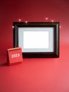 Template for photo frame for card and small 2023 year red desk calendar and love like heart icons on red background. Royalty Free Stock Photo