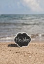 Template for summer with a chalkboard on beach Royalty Free Stock Photo