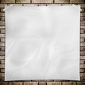 Template- White crumpled square Poster on grunge brick wall Royalty Free Stock Photo