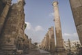 Temple of Artemis in the ancient Roman city of Gerasa preset-day Jerash, Jordan. High columns of the Roman era against the blue Royalty Free Stock Photo