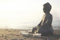 A temple with buddha statue and lit candles that illuminate the spirit Royalty Free Stock Photo