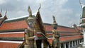 Temple with classical glass decoration srt and golden Yaksa giant in guarding royal temple , Bangkok , Thailand