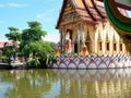 View of the temple of Plai Laem across the pond, Koh Samui, Thailand.