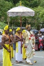 A Temple Custodian parades during the Day Perahera.