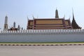 Temple of Emerald Buddha Wat Phra Kaew in Bangkok, Thailand with tree branches front isolated on blue sky background closeup. Is Royalty Free Stock Photo