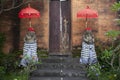 Temple entrance with bedogol guardian carved stone statues in Bali, Indonesia.