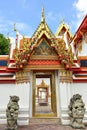 Temple entrance with stone lion, Bangkok Thailand Royalty Free Stock Photo