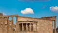 Temple of Erechtheion with the Caryatids statues in Acropolis, Greece against a blue sky Royalty Free Stock Photo