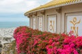 Temple with flowers on the coast of the South China Sea on the territory of Buddhist center Nanshan