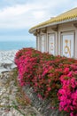 Temple with flowers on the coast of the South China Sea on the territory of Buddhist center Nanshan