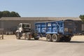 Truck and trailer loaded with grain in a farmyard. Royalty Free Stock Photo