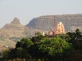 Temple on a hill top in nashik, Maharashtra with Plateaus in background