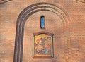 Temple icon in an arched niche on the facade of the chapel of St. George the Victorious. Kaliningrad