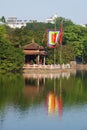 The temple of the Jade mountain on the lake Hoankyem in the sunny day