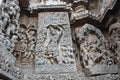 Hoysaleswara Temple outside wall carved with sculpture of Lord krishna lifting govardhana giri Royalty Free Stock Photo