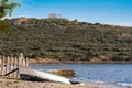 Temple of Poseidon in the background and on the front of an old fishing boat Royalty Free Stock Photo