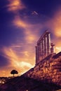 The Temple of Poseidon and a tree. Cape Sounion, Greece. Soft focus Royalty Free Stock Photo