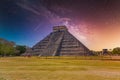 Temple Pyramid of Kukulcan El Castillo, Chichen Itza, Yucatan, Mexico, Maya civilization with Milky Way Galaxy stars night sky Royalty Free Stock Photo