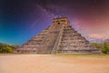 Temple Pyramid of Kukulcan El Castillo, Chichen Itza, Yucatan, Mexico, Maya civilization with Milky Way Galaxy stars night sky Royalty Free Stock Photo