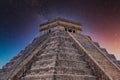 Temple Pyramid of Kukulcan El Castillo, Chichen Itza, Yucatan, Mexico, Maya civilization with Milky Way Galaxy stars night sky Royalty Free Stock Photo