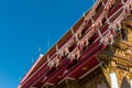 Temple roof vintage Thai style with against blue sky background