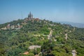 Temple of the Sacred Heart of Jesus and Tibidabo amusement park in Barcelona viewed from Torre de Collserola, Spain Royalty Free Stock Photo