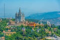 Temple of the Sacred Heart of Jesus and Tibidabo amusement park in Barcelona viewed from Torre de Collserola, Spain Royalty Free Stock Photo