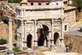 Temple of Saturn. The triumphal arch of Septimius Severus. Roman Forum, Rome, Italy. Royalty Free Stock Photo