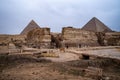 Temple of the Sphinx against the background of the pyramids of the pharaohs Cheops and Khafre in Giza, Egypt Royalty Free Stock Photo