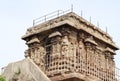 Temple Stone carved idols on the wall. The rock wall is located in the background