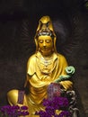 A golden statue of Avalokiteshvara in a temple in Taiwan. Royalty Free Stock Photo