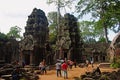 ANGKOR WAT, SIEM REAP, CAMBODIA, October 2016, Visitors at temples in Ta Prohm, Jungle temple with massive trees growing out of it