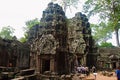 Temples in Ta Prohm, Angkor, Cambodia. Jungle temple with massive trees growing out of its walls