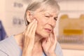 Temporal arteritis woman painful jaw joints Royalty Free Stock Photo