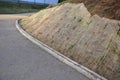 Temporary covering of the lawn sowing with textiles to ensure a large slope against erosion. using brown jute fabric stabilizing c