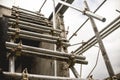 A temporary and makeshift stair made from metal pipe scaffolding made to access an upper level of a building under construction.