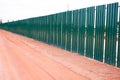 Temporary metal fence around the construction site Royalty Free Stock Photo