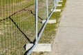Temporary metallic portable fence with concrete base blocks to limit the territory Royalty Free Stock Photo
