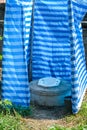 Temporary outdoor toilet plastic wall cover not confortable and dirty Royalty Free Stock Photo