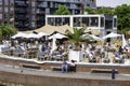 Temporary pop-up city beach club restaurant. Terrace with enough of space between tables following the rules of social distancing