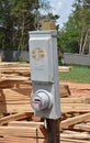 Temporary power pole on home construction site