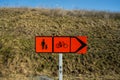 Temporary sign showing alternate route for pedestrians and bicyclists..