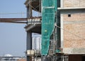 Temporary staircase made of steel and scaffolding that connects floor by floor. Used by construction workers.