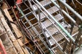 Temporary steel metal staircase into deep basement excavation on construction site